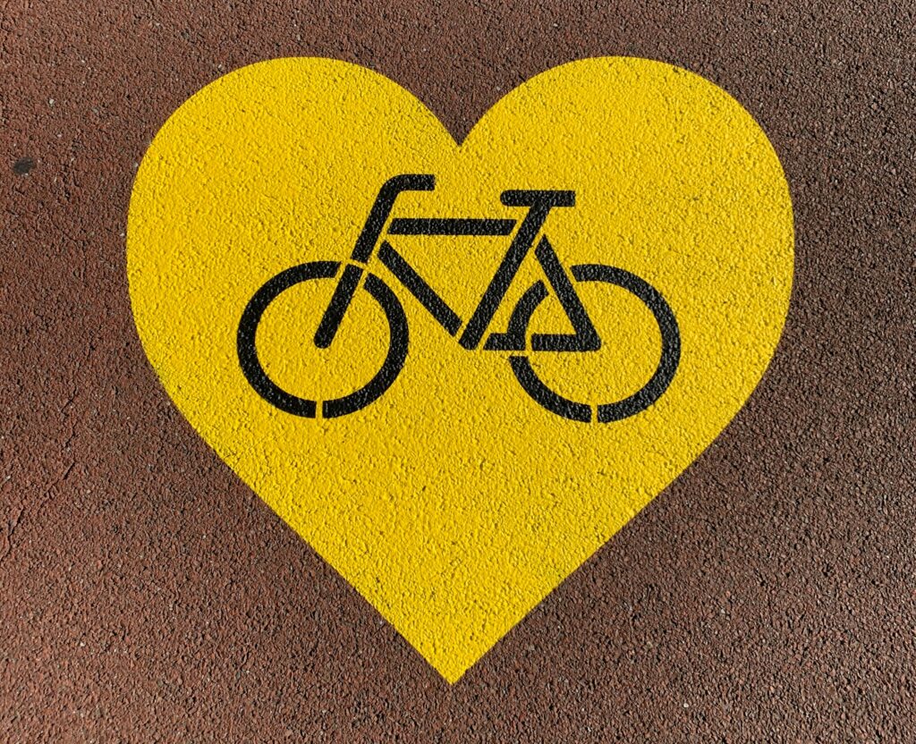 Bike stencil inside yellow heart 